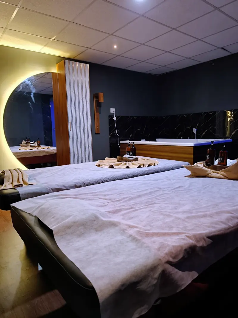 Aura couple suite with two massage beds and a Jacuzzi