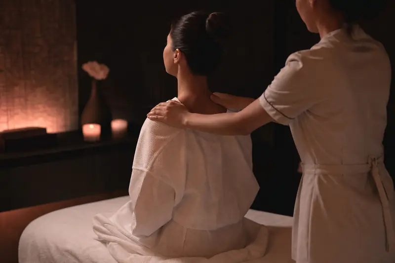 Therapist giving a guest a Swedish shoulder massage